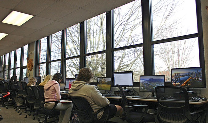 John I. Burton High School students hard at work in the library, accompanied by a pleasant view through the new windows.  KENNETH CROWSON PHOTO