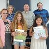 Norton School Board on May 9 recognized students who submitted their art to the Virginia School Boards Association Southwest Regional Art Contest. Left to right are art teacher Kim McCarty, Lindsey Harvey and Carleia Abygail Gonzalez. Not pictured is student Ashlyn Wermann.  KENNETH CROWSON PHOTO