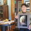 Bonnie Aker, founding member of the Fall Fling Committee and Wise Business Association, with her photo of Doe River Gorge. She plans to spend more time traveling and photographing after stepping down from the fling’s committee.  KENNETH CROWSON PHOTO