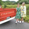 Cece and Savannah Walker, visiting their grandfather from Fall Church, pose in front of a vintage Studebaker during Saturday’s car show at The Laurels. LESLIE GILLIAM PHOTO