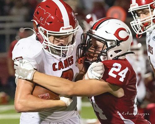 Jake Pinkard wrestles the ‘Canes running back to the ground. PHOTO BY SAMMY BELCHER