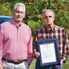 Donnie and John Pickett display a November 2019 county supervisors’ resolution requesting the dedication for Pickett, who was killed May 24, 1967 ‘during a training exercise on his last patrol in country.’  R.J. ROSE PHOTO