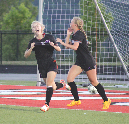 Olivia Webb celebrates her goal as the Lady Warriors advance to the Region 2D championship. PHOTO BY CHLOE BURDETTE