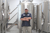 Great Oak Brewery's Head Brewer Keith Dancy stands with the equipment that will power the company's Norton location to open next year, serving locals and our Southwest Virginia neighbors.  KENNETH CROWSON PHOTO