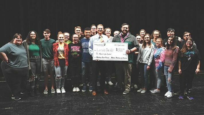 Josh Adkins, local Modern Woodmen managing partner in Coeburn, presented Eastside High School One Act team a check for $1,500.