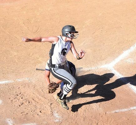 Eastside’s Anna Whited jukes out of the way of the tag to score a run Thursday at Northwood. PHOTO BY KELLEY PEARSON